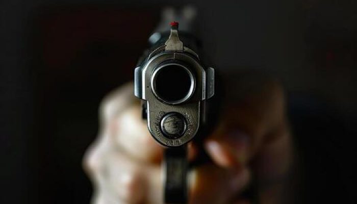 man-aims-through-the-sight-of-combat-metal-pistol-to-hit-the-target-photo.jpg